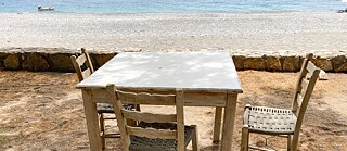 Table and stools on the beach