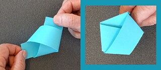 Iš šviesiai mėlyno popieriaus juostelės išlankstytas penkiakampis