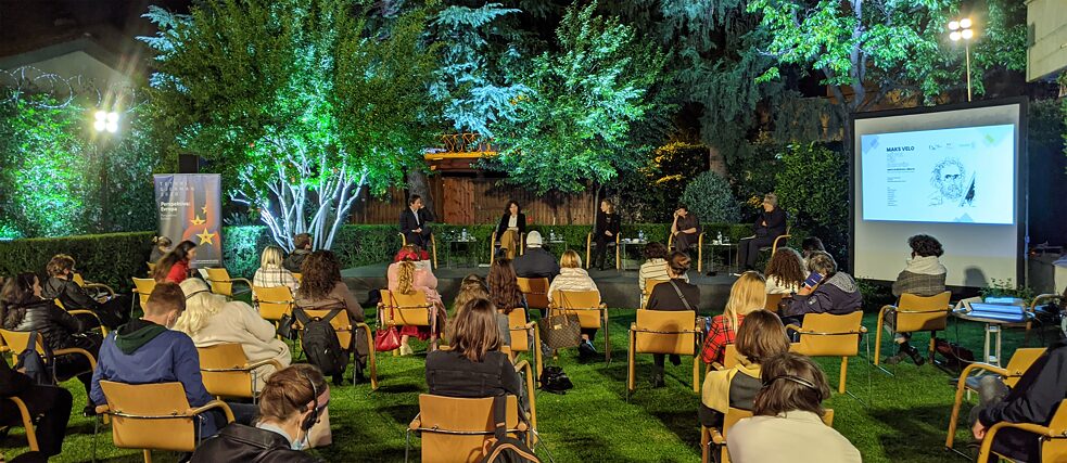 An evening discussion beneath trees: Tell Me about Europe in Tirana, Albania