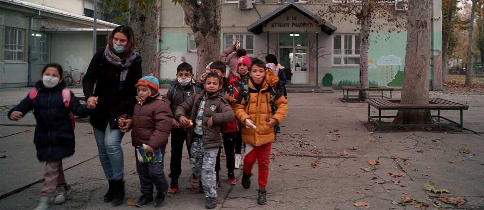 A community assistant accompanies children back home after school, Dušan Radović Primary School, Novi Sad 