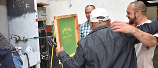 JornARTleros, a project designed by Joel, converted Self Help Graphics & Art into a design house for low wage workers focusing on Street Vendors and Day Laborers to transfer the screen-printing process and knowledge to these individuals. These marginalized entrepreneurs, upon completing the project left with a set of brand work apparel and their own personalized silkscreen. 