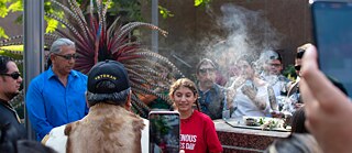 Youth celebrate on top on the pedestal where minutes earlier the Columbus Statue stood. Youth spoke about what they imagine would replace the former monument.