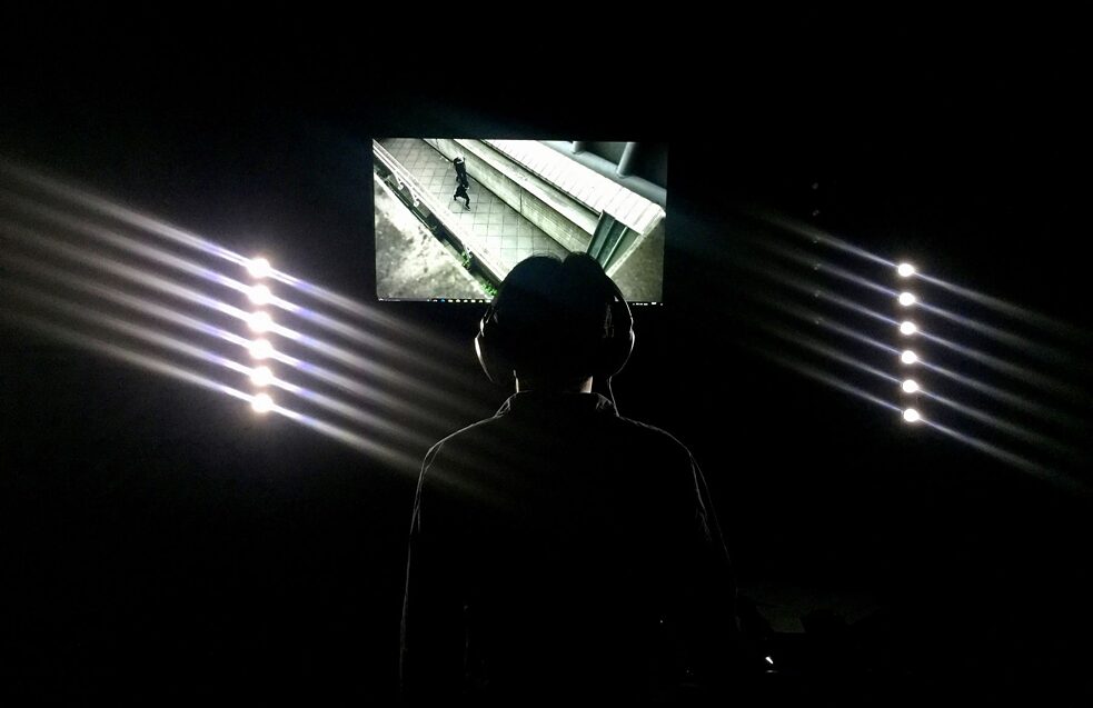 A visitor to the Peru Museum of Modern Art watching “RIOT”