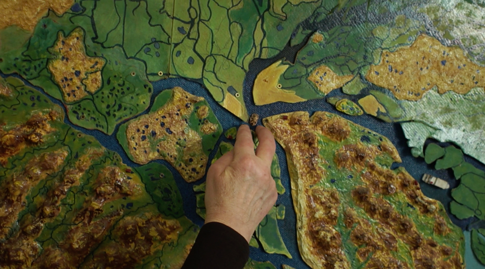 A scientist explains the specificities of the local geo landscape in Tiksi natural reserve museum. 
