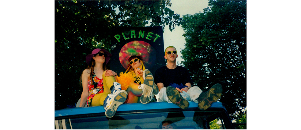 The first Loveparade in 1989 was a techno carnival organised by techno DJ Dr. Motte in 1989 – with just 150 attendees – that processed through the streets of Berlin and was attracting interest beyond the region by 1991. These three were amongst the participants that year – who already numbered 6,000 at that point. 