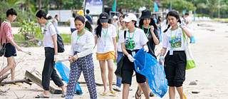 Collecting garbage on the beach