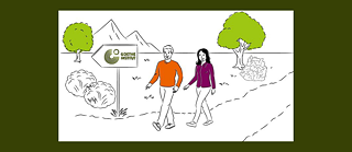 2 people walking on a path signposted by a Goethe-Institut Logo