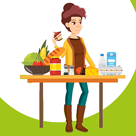 A woman is standing at a table on which various foods are arranged.