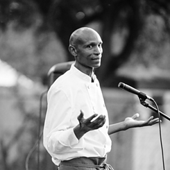 Black and white image of Njathi Kabui during a public speech