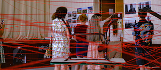 Founder Vitaliy Matukhno guides visitors through the exhibition in Rubizhne  