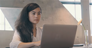 Girl studying with a laptop