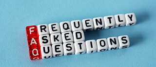 FAQ Frequently Asked Questions written on cubes on blue background