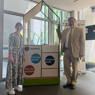 Next to the Infohaus are standing two people