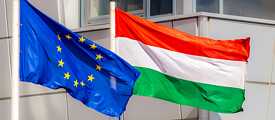 European flag and Hungarian flag flutter in the wind