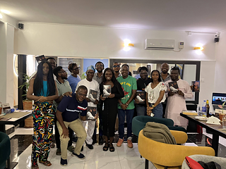 The Book Club Lagos members holding up My transition hours