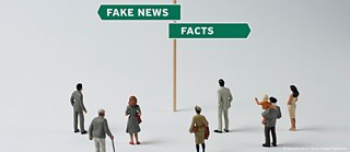 A graphic of a crowd looking at a signpost, which directs into two different directions