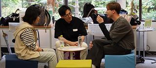 three people talking