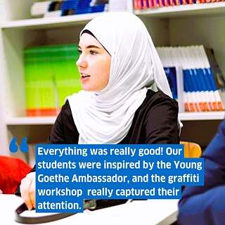 A student in a niqab speaking at a round-table. Superimposed the text: Everything was really good! Our students were inspired by Julia; the graffiti workshop was perfectly pitched for our students and really captured their attention.
