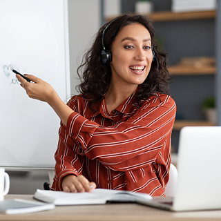 Teacher interacting with audience on laptop