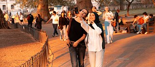 Two girls in a park taking a selfie