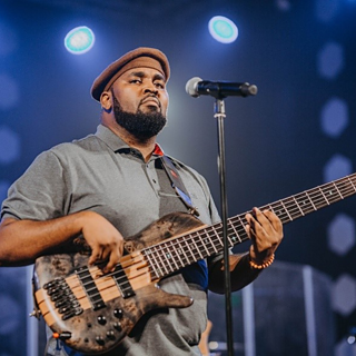 Mubba playing guitar