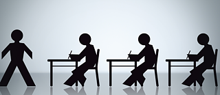 A silhouette illustration shows a person walking towards a row of three seated individuals who are sitting at desks and writing.