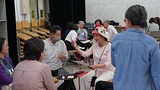Participants sharing experiences and comparing notes during a group activity