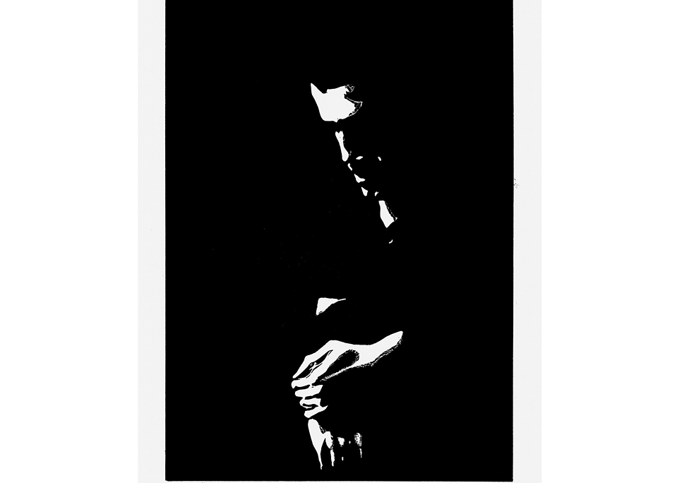 Black and white linocut depicting a man looking down.