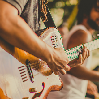 Someone playing a guitar