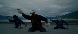 So Surreal: Behind the Masks, dir. Joanna Robertson, Neil Diamond | Masked Dancers on the Shore