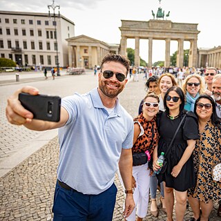 A TOP study tour taking a selfie in front of the Brandenburg Gate in Berlin, Germany.