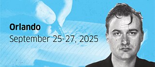 Portrait of Iven Yorick Fenker on a ligh blue background with a hand holding a pen