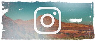 A street sign with the Instagram logo and two red arrows