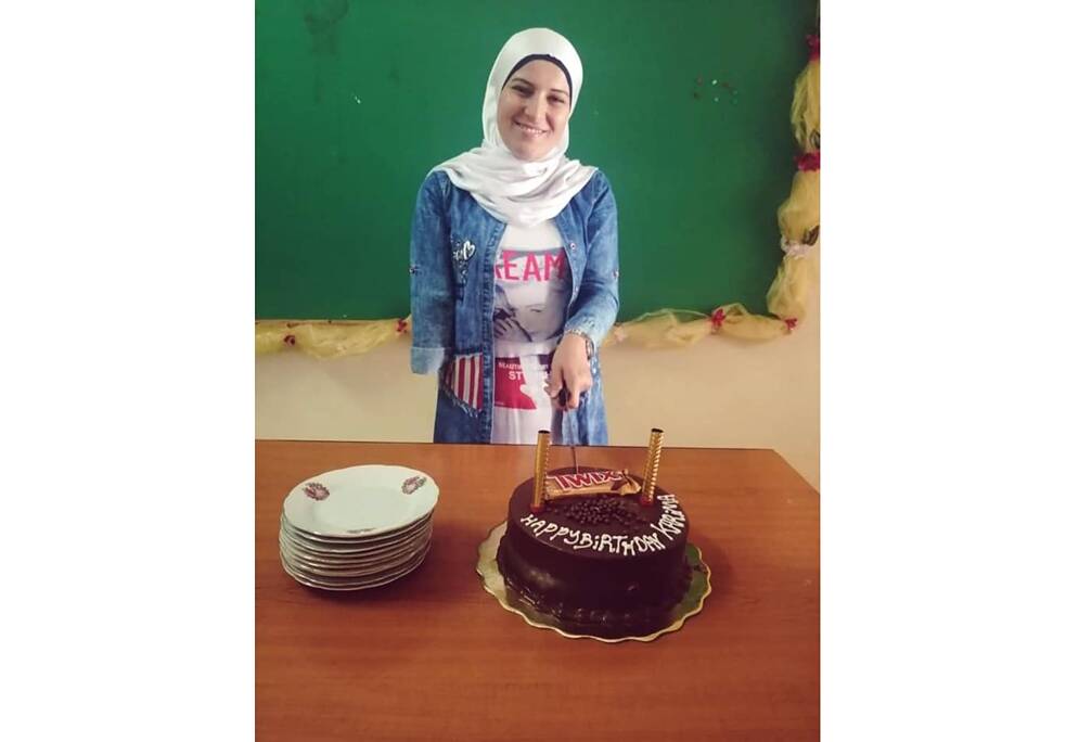 Karima explains that she needs help from her mother and siblings to put on clothes like dresses with zippers or buttons. 