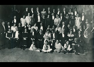 A group of people at a wedding in the year 1923