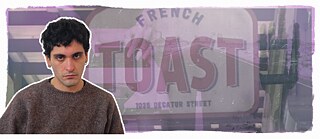 A portrait photo of Mücahit Türk against a purple background, with a street and a church in the background. 