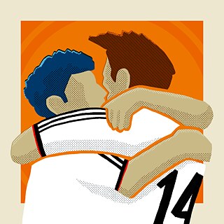 Image of two soccer players hugging. 