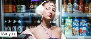 Artist Mariybu in front of a fridge with different beverages 