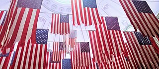  Photograph of the 2017 exhibition "A Living Thing: Flag Exchange", a collection of 50 flags at at the NYC Federal Hall National Monument