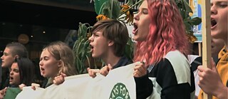 screenshot from the film As We Burn depicting young people protesting
