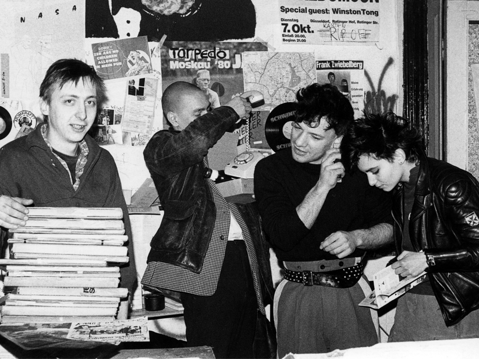 Rip Off, the Hamburg punk record store founded by Klaus Maeck (left); Mark Chung and FM Einheit of Einstürzende Neubauten and Mona Mur, from left to right, Hamburg, 1980.