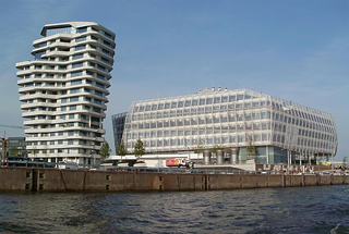 <b>Marco Polo Tower in Hamburg</b><br/>Modern and futuristic: Completed in 2009, the Marco Polo Tower designed by Stuttgart-based Behnisch Architekten is an elegant shape in Hamburg’s silhouette as seen from the Elbe River. Each of the 17 stories is slightly offset and larger than the floor below, so the curved, terraced apartment building resembles a huge funnel.