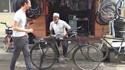 Oliver Walker in front of a bike shop