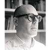 Portrait image of Michael Zichy in grayscale; he is wearing glasses and a checkered shirt
